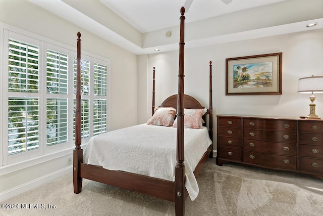 bedroom featuring light colored carpet