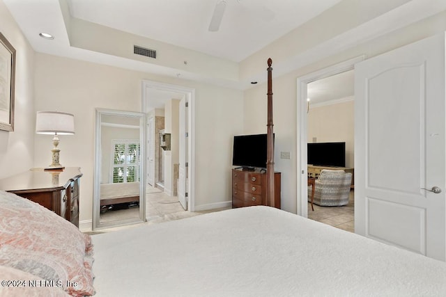 bedroom with ensuite bath and ceiling fan