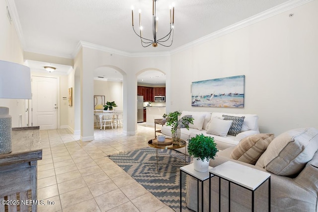 living room featuring light tile patterned floors, crown molding, and an inviting chandelier