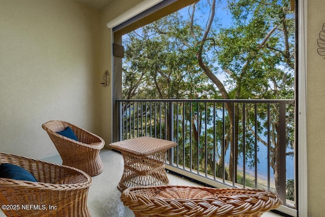 balcony featuring a water view