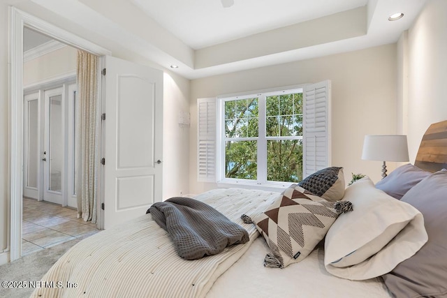 bedroom with a tray ceiling