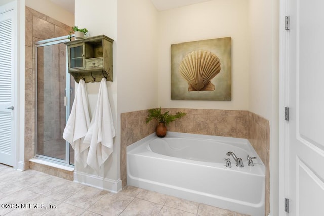 bathroom with tile patterned flooring and independent shower and bath