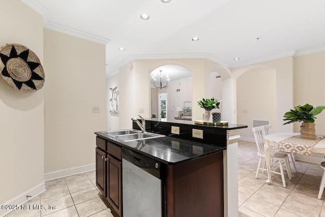 kitchen featuring dark brown cabinets, stainless steel dishwasher, ornamental molding, sink, and a kitchen island with sink