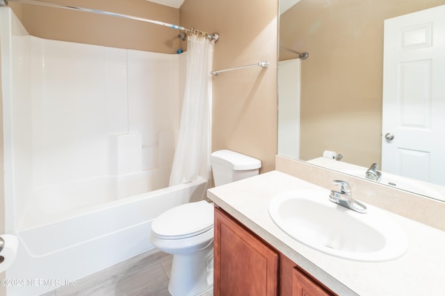 full bathroom featuring shower / bath combo, vanity, toilet, and hardwood / wood-style floors