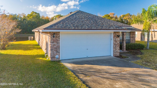 garage featuring a lawn