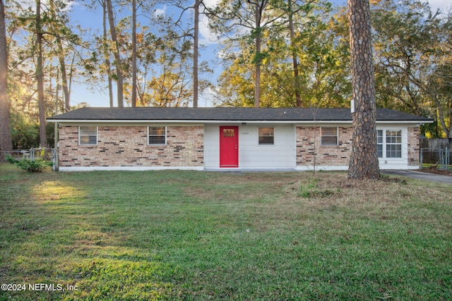 view of outdoor structure featuring a lawn