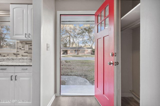 doorway to outside featuring dark hardwood / wood-style floors