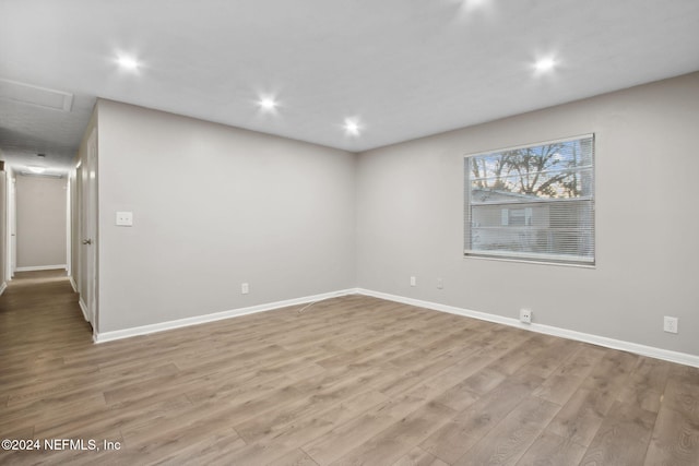 unfurnished room featuring light hardwood / wood-style floors