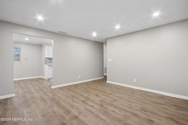 unfurnished room featuring light wood-type flooring