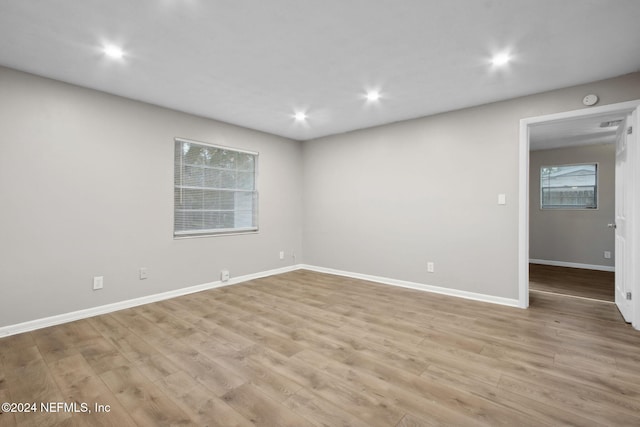 spare room featuring light wood-type flooring