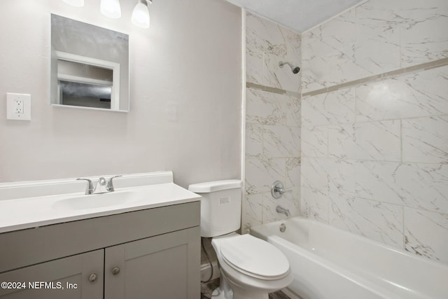 full bathroom featuring toilet, vanity, and tiled shower / bath