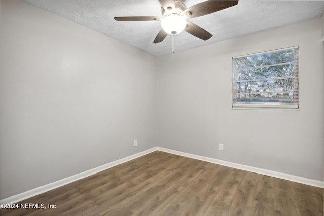 spare room featuring hardwood / wood-style floors, a textured ceiling, and ceiling fan