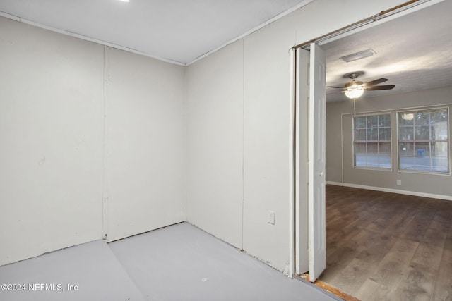 spare room featuring ceiling fan and hardwood / wood-style flooring