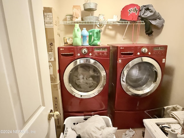 clothes washing area featuring independent washer and dryer