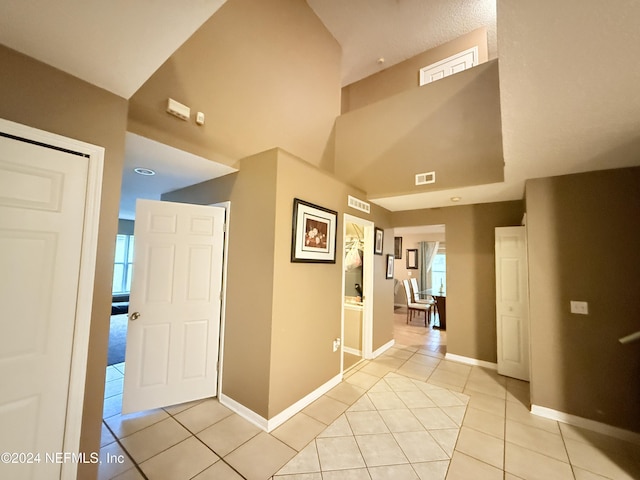 corridor featuring light tile patterned flooring