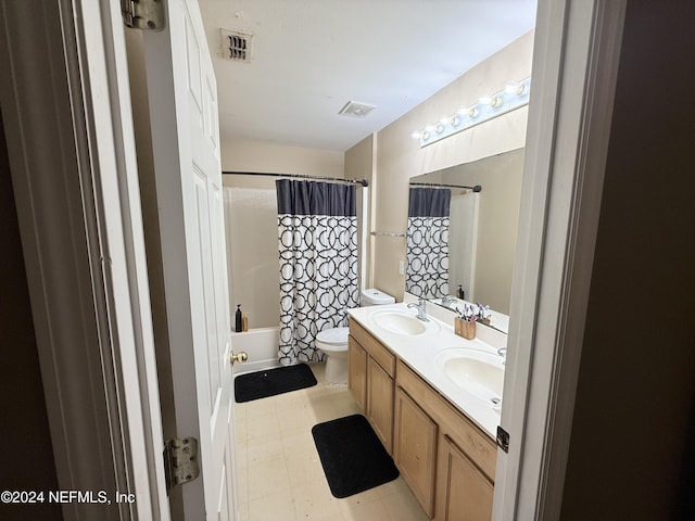 full bathroom featuring vanity, shower / bath combination with curtain, and toilet