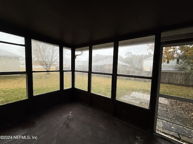 unfurnished sunroom with plenty of natural light