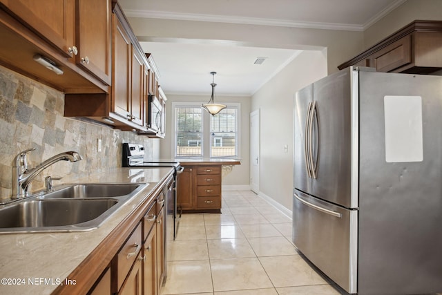 kitchen with decorative backsplash, stainless steel appliances, sink, decorative light fixtures, and light tile patterned flooring