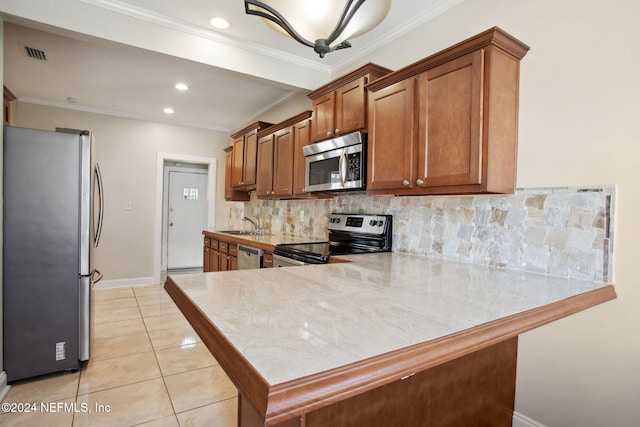 kitchen featuring sink, light tile patterned floors, ornamental molding, appliances with stainless steel finishes, and kitchen peninsula