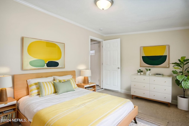 carpeted bedroom featuring crown molding