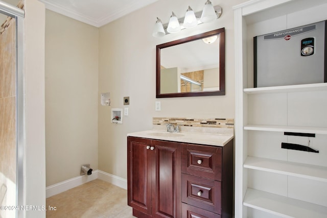 bathroom with vanity, tile patterned floors, walk in shower, and crown molding