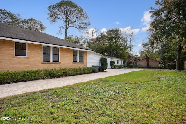 view of home's exterior with a yard