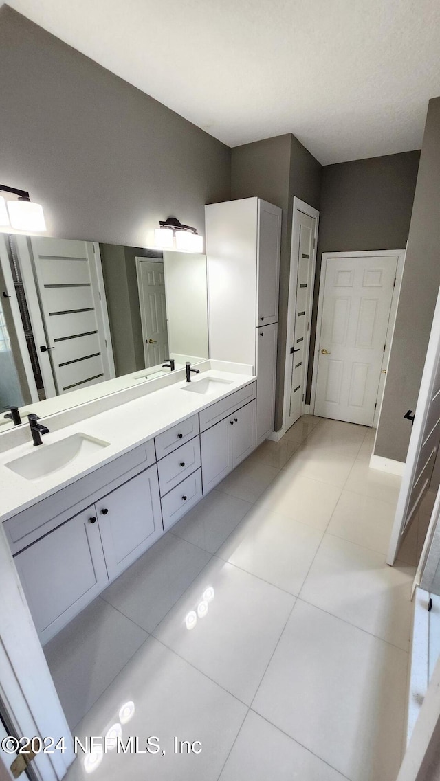 bathroom featuring tile patterned floors and vanity