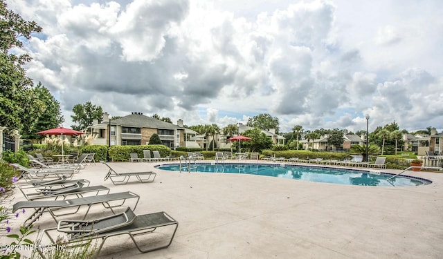 view of swimming pool featuring a patio