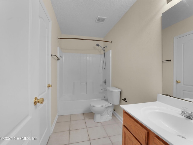 full bathroom featuring vanity,  shower combination, tile patterned floors, toilet, and a textured ceiling