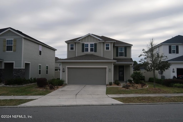 front of property with a garage