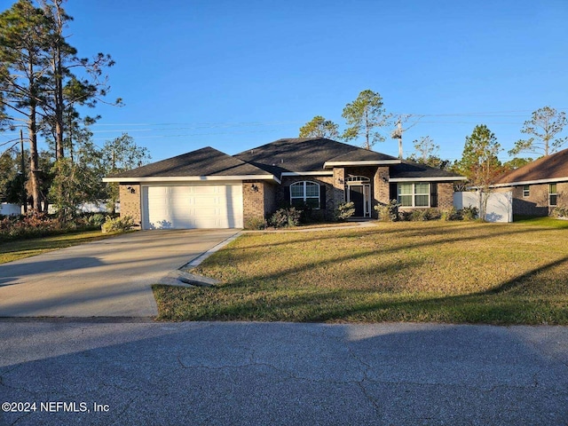 single story home with a garage and a front yard