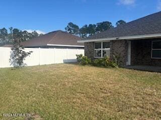 view of home's exterior with a lawn