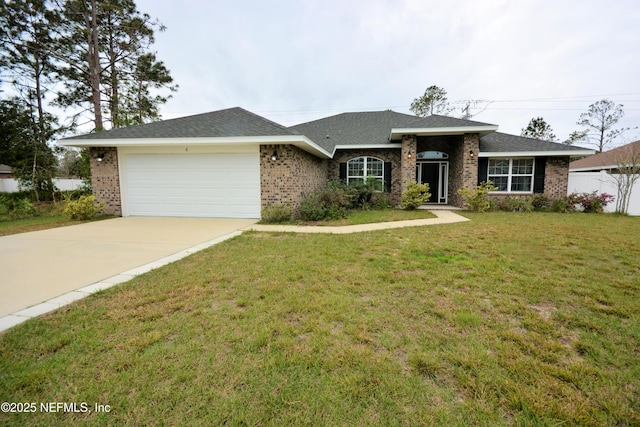 view of front of house featuring a garage and a front lawn