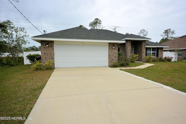 view of front of home featuring a garage and a front yard