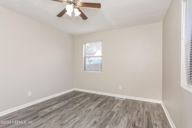 spare room featuring ceiling fan and hardwood / wood-style flooring