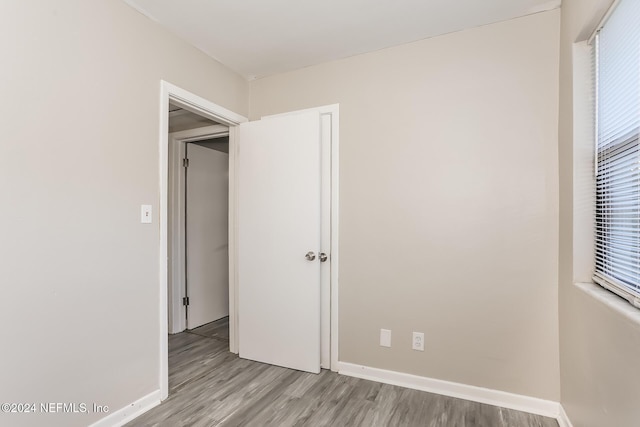 unfurnished bedroom featuring light wood-type flooring