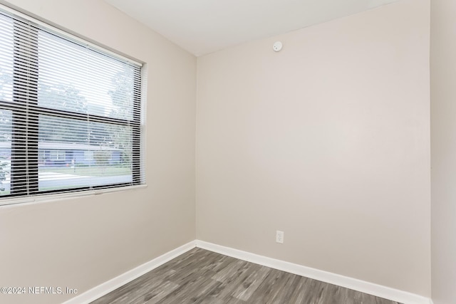 empty room with hardwood / wood-style flooring