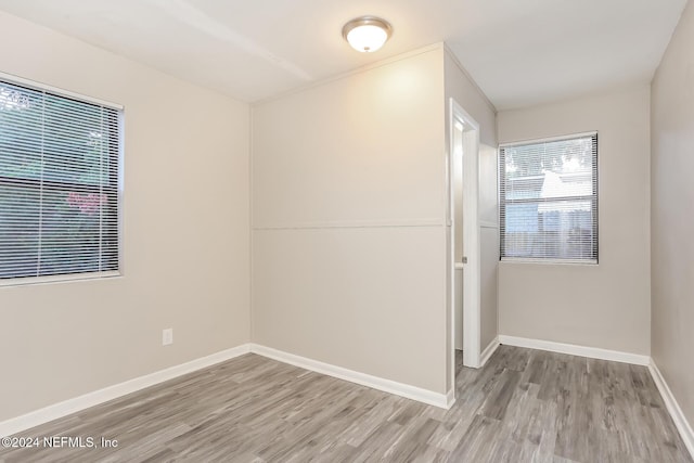 spare room featuring light wood-type flooring