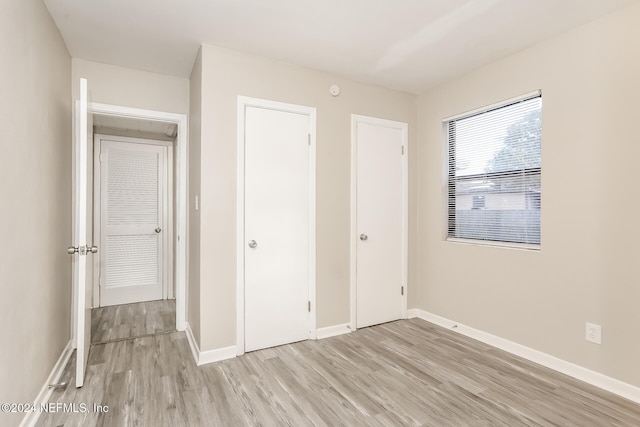 unfurnished bedroom with light hardwood / wood-style flooring