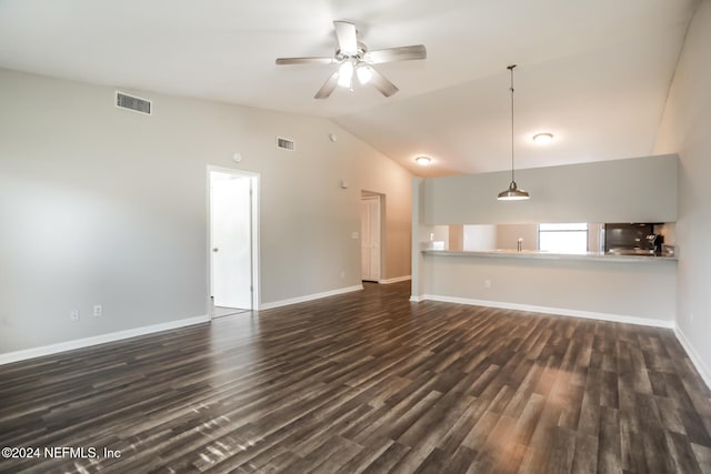 unfurnished living room with ceiling fan, dark wood-type flooring, and vaulted ceiling