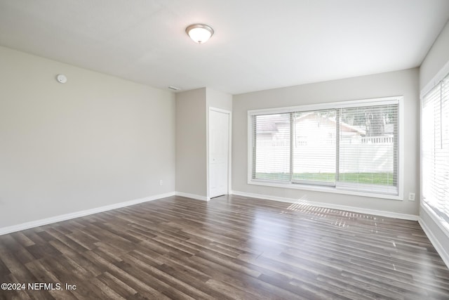 unfurnished room featuring dark hardwood / wood-style floors