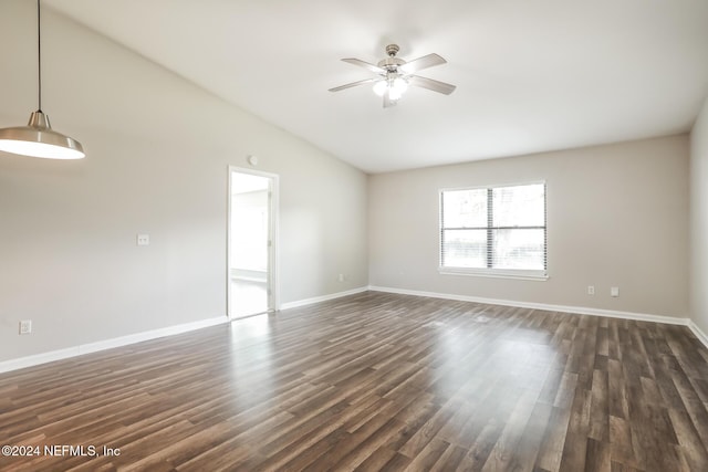 unfurnished room with dark hardwood / wood-style floors, ceiling fan, and vaulted ceiling