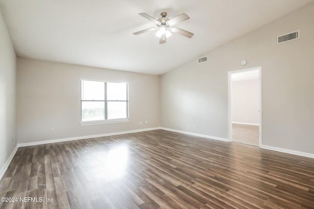 spare room featuring high vaulted ceiling, ceiling fan, and dark wood-type flooring