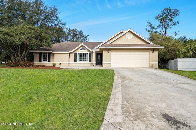 ranch-style house with a garage and a front yard