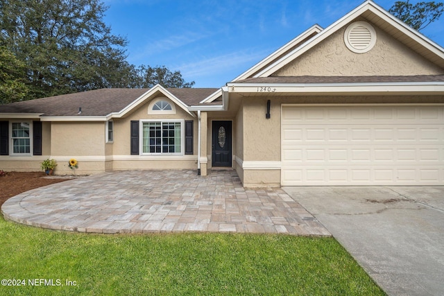 view of front of home with a garage