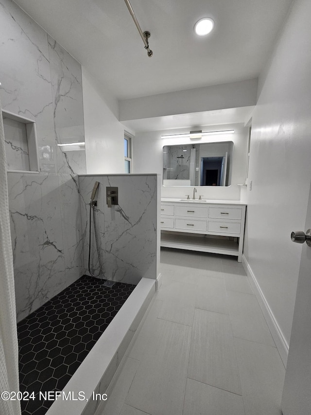 bathroom featuring vanity and a shower