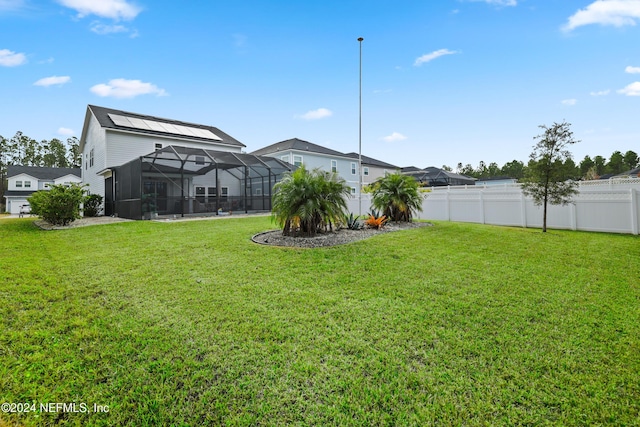 view of yard featuring glass enclosure