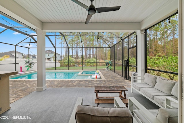 view of pool featuring an outdoor living space, a patio, ceiling fan, and a lanai