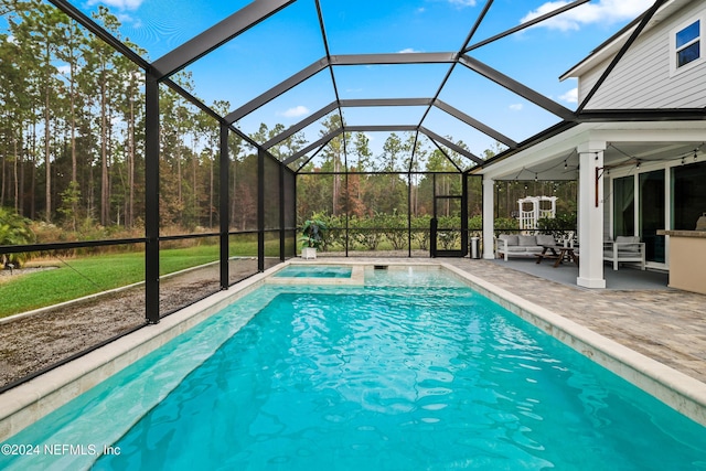 view of pool featuring an outdoor living space, a patio, and glass enclosure