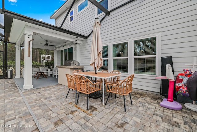 view of patio / terrace featuring area for grilling and ceiling fan